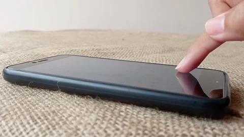 Texting on the phone with one finger Stock Footage 150599498