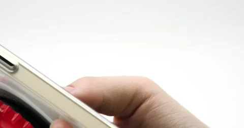 Texting on smartphone close up on thumb side view isolated on white Stock Footage 218412280