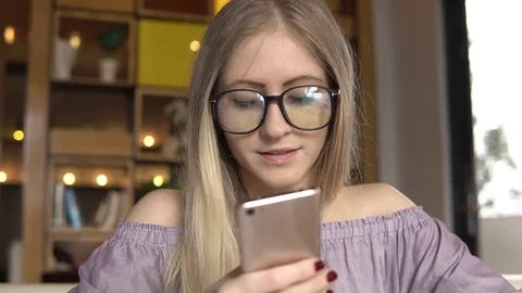 Texting on smartphone. Woman using mobile phone Video stock 83942993