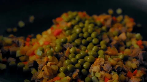 Textural cook turning a pepper above the burner in top view, 4K Stock Footage 341115464