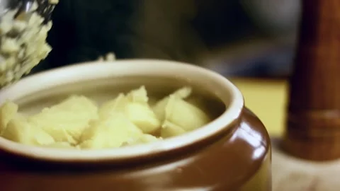 Textural fresh potato chunks drained after boiling in soft focus, 4K Stock Footage 341103319