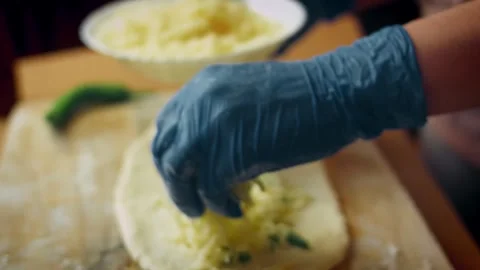 Textural minced meat mixture spread over fresh pide dough in detail, 4K Stock Footage 341114013