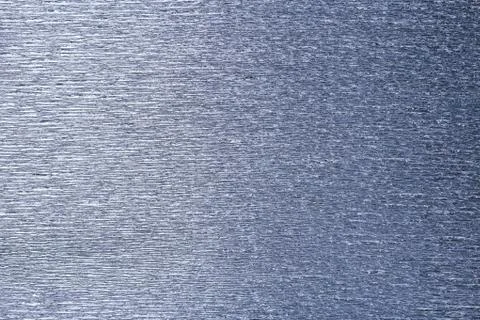 Textural of silver background of wavy corrugated paper, closeup. Stock Photos