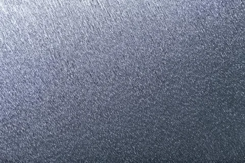Textural of silver background of wavy corrugated paper, closeup. Stock Photos