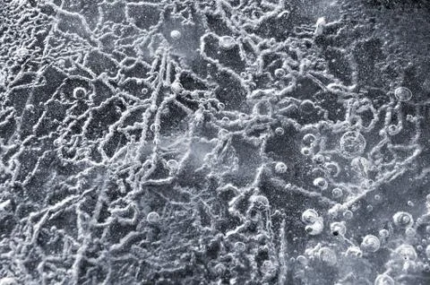 Texture abstract closeup background ice with grooves, furrows, and bubbles of Stock Photos