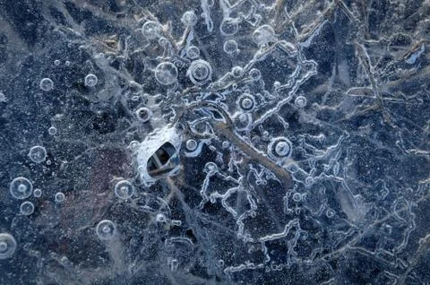 Texture abstract closeup background ice with grooves, furrows, and bubbles of Stock Photos