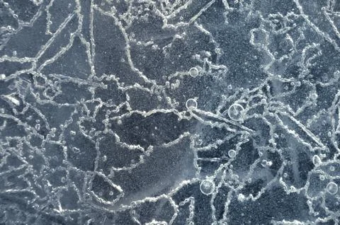 Texture abstract closeup background ice with grooves, furrows, and bubbles of Stock Photos