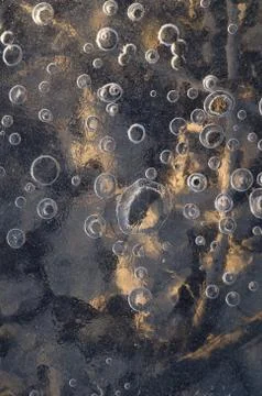 Texture abstract closeup background ice with grooves, furrows, and bubbles of Stock Photos