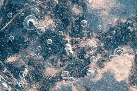 Texture abstract closeup background ice with grooves, furrows, and bubbles of Stock Photos