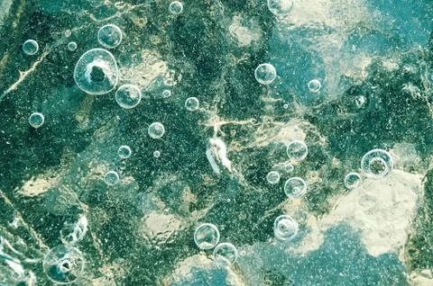 Texture abstract closeup background ice with grooves, furrows, and bubbles of Stock Photos