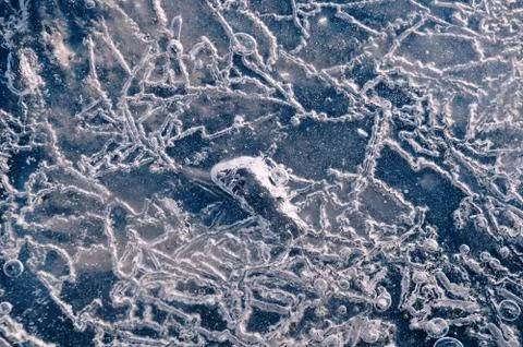 Texture abstract closeup background ice with grooves, furrows, and bubbles of Stock Photos