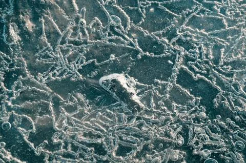 Texture abstract closeup background ice with grooves, furrows, and bubbles of Stock Photos