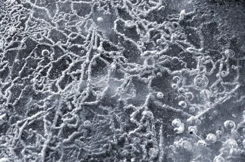 Texture abstract closeup background ice with grooves, furrows, and bubbles of Stock Photos