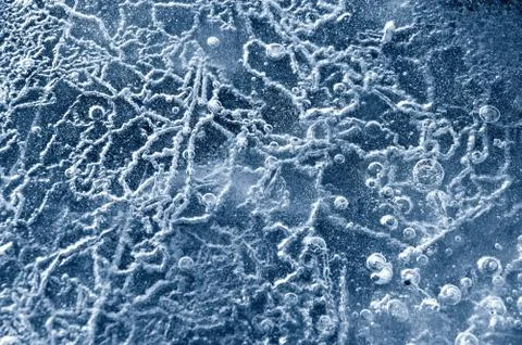 Texture abstract closeup background ice with grooves, furrows, and bubbles of Stock Photos