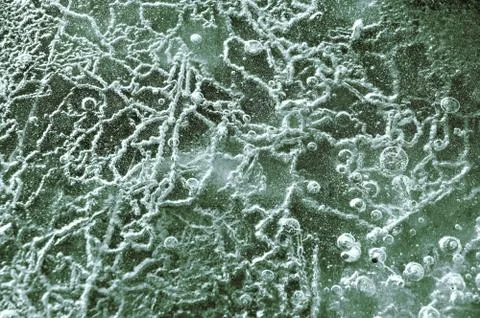 Texture abstract closeup background ice with grooves, furrows, and bubbles of Stock Photos