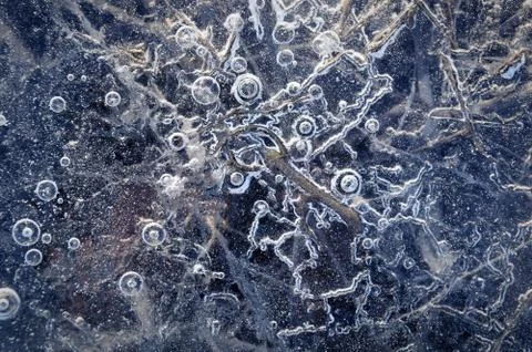 Texture abstract closeup background ice with grooves, furrows, and bubbles of Stock Photos