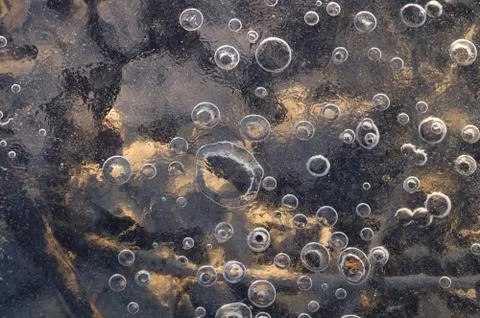 Texture abstract closeup background ice with grooves, furrows, and bubbles of Stock Photos