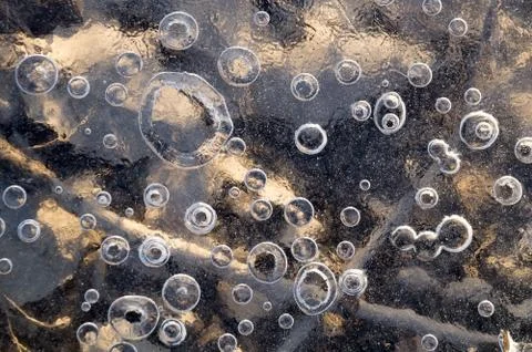 Texture abstract closeup background ice with grooves, furrows, and bubbles of Stock Photos