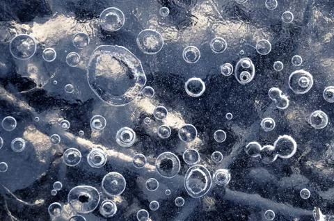 Texture abstract closeup background ice with grooves, furrows, and bubbles of Foto stock