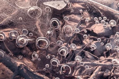 Texture abstract closeup background ice with grooves, furrows, and bubbles of Stock Photos