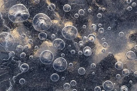Texture abstract closeup background ice with bubbles of air caught by frost in Foto stock