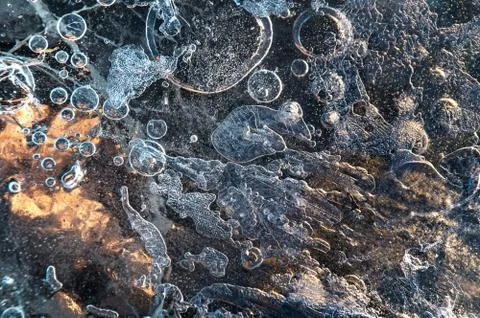 Texture abstract closeup background ice with grooves, furrows, and bubbles of Stock Photos