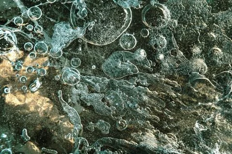 Texture abstract closeup background ice with grooves, furrows, and bubbles of Stock Photos