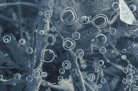 Texture abstract closeup background ice with bubbles of air caught by frost in Stock Photos