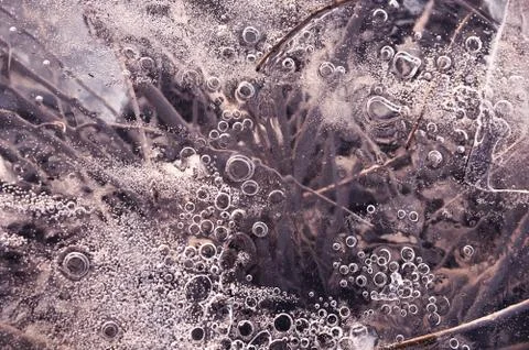 Texture abstract closeup background ice with bubbles of air caught by frost in Stock Photos