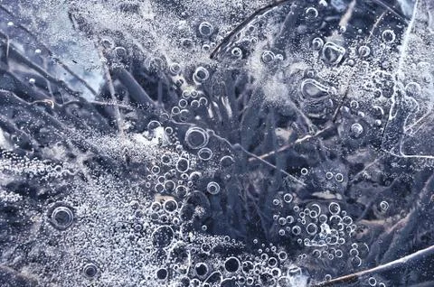 Texture abstract closeup background ice with bubbles of air caught by frost in Stock Photos