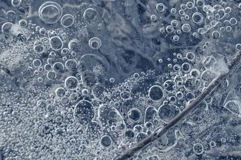 Texture abstract closeup background ice with bubbles of air caught by frost in Stock Photos