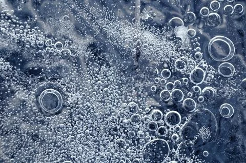 Texture abstract closeup background ice with bubbles of air caught by frost in Stock Photos