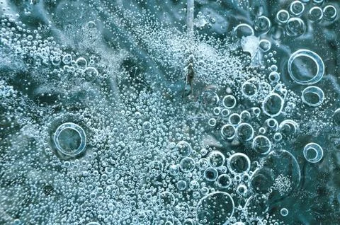 Texture abstract closeup background ice with bubbles of air caught by frost in Stock Photos