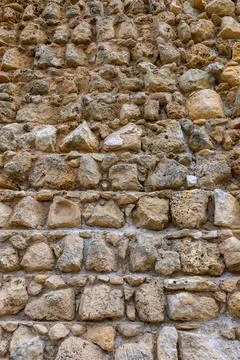 Texture of an ancient brick wall made of sandstone. Archaeological excavati.. Stock Photos