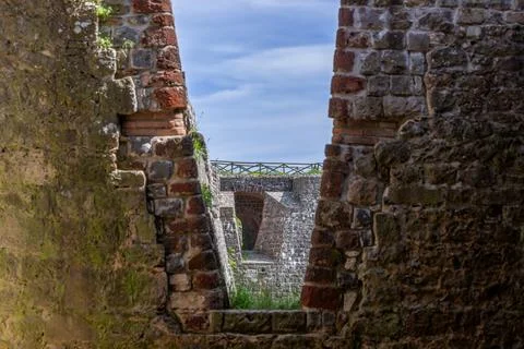 The texture of ancient brickwork with V-shaped opening in the tower Rocca of Stock Photos