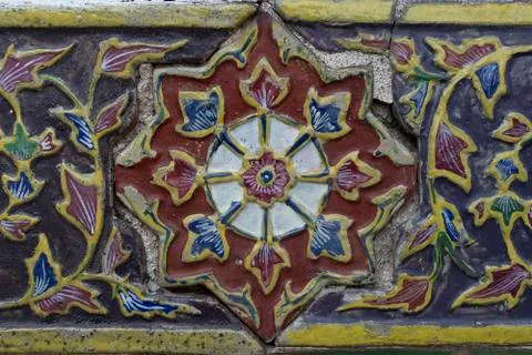 Texture of Ancient Ceramic tile decorated with Thai art Stock Photos