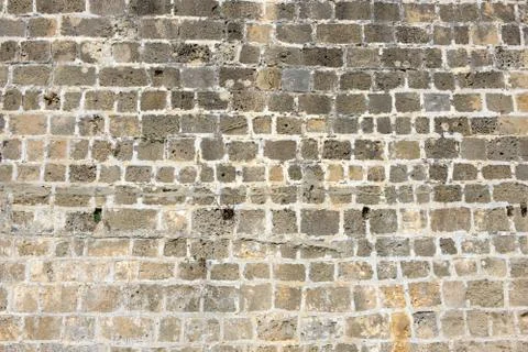 Texture of the ancient stone wall of the ancient city Stock Photos