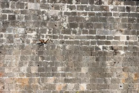 Texture of the ancient stone wall of the ancient city 库存照片