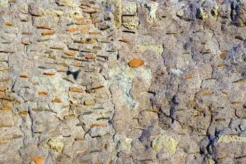 Texture of the ancient stone wall of the ancient city Stock Photos