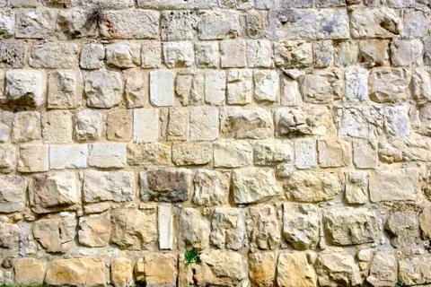 Texture of the ancient stone wall of the ancient city Stock Photos