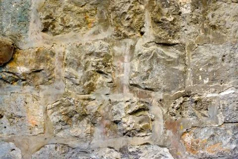 Texture of the ancient stone wall of the ancient city Stock Photos