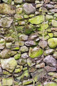 Texture of an ancient stone wall Stock Photos