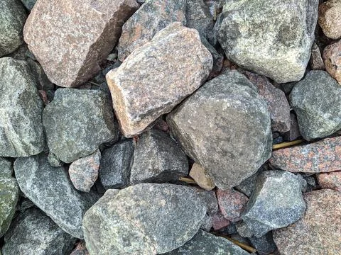 Texture and background of colored stones on the river bank in the daytime 写真素材