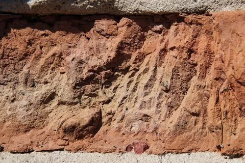 Texture and background of old broken orange brick for design. Stock Photos