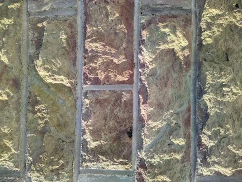 Texture and background of the stone facade of the building closeup photo Foto stock