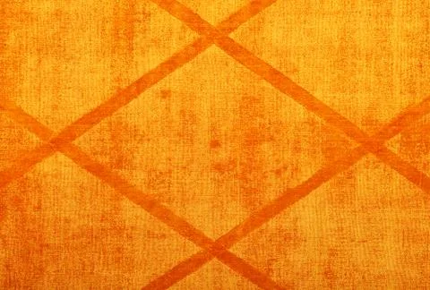 Texture and background of a textile surface in orange with a diamond-shaped p Stock Photos