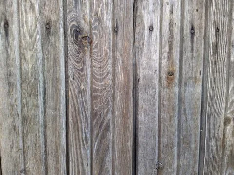 Texture and background of a vertical old and worn wooden fence Foto stock