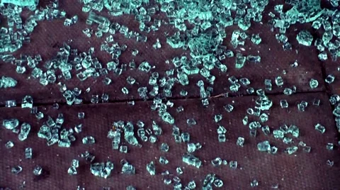 Texture and Backgrounds - Beads of smashed glass on concrete paving. Stock Footage 8659998
