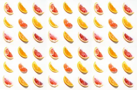 Texture and Pattern from chopped fruit oranges and grapefruits isolated on a  Stock Photos