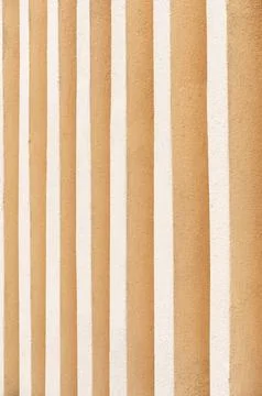 Texture and pattern create an abstract composition on a sunlit wall surface Foto stock